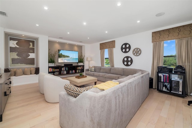 826 Honeyflower Loop, Bradenton, FL 34212 - living room featuring light wood-style flooring and recessed lighting