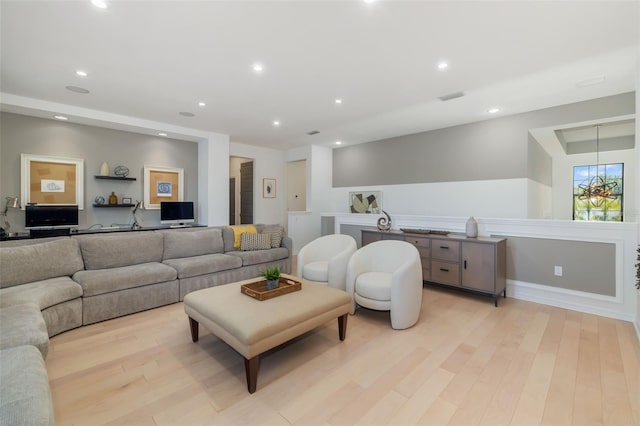 826 Honeyflower Loop, Bradenton, FL 34212 - living area featuring light wood-style flooring and recessed lighting