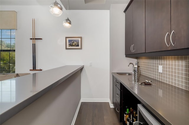 826 Honeyflower Loop, Bradenton, FL 34212 - kitchen featuring stainless steel countertops, dark wood-style floors, backsplash, and dark brown cabinetry