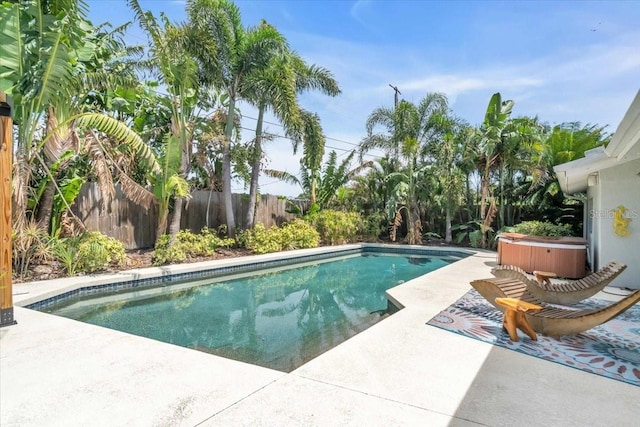 6731 Washington Pl, Bradenton, FL 34207 - view of pool with a hot tub, a patio, and a fenced backyard