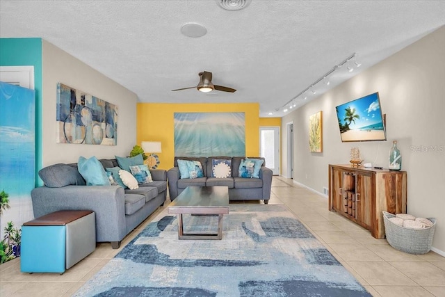 6731 Washington Pl, Bradenton, FL 34207 - tiled living area with track lighting, ceiling fan, and a textured ceiling