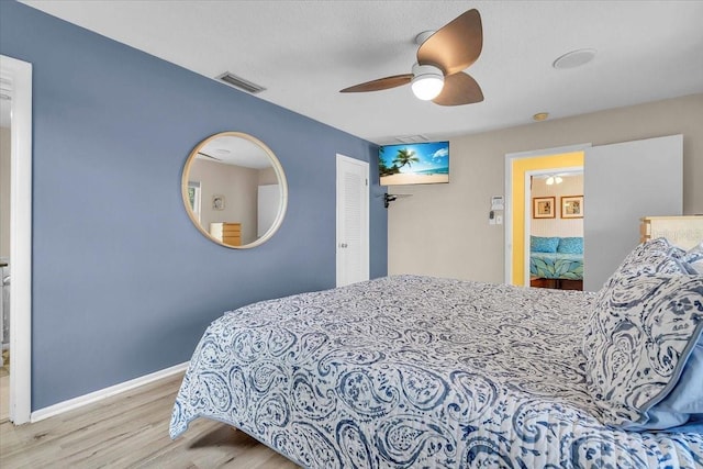6731 Washington Pl, Bradenton, FL 34207 - bedroom with wood finished floors, baseboards, ceiling fan, and a closet