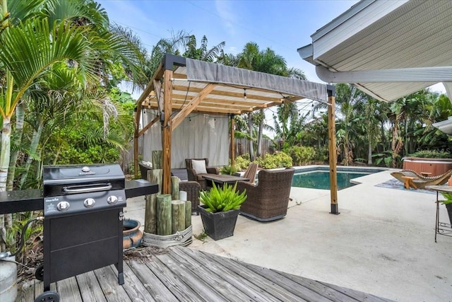 6731 Washington Pl, Bradenton, FL 34207 - deck with a fenced backyard, an outdoor pool, a patio, and a grill