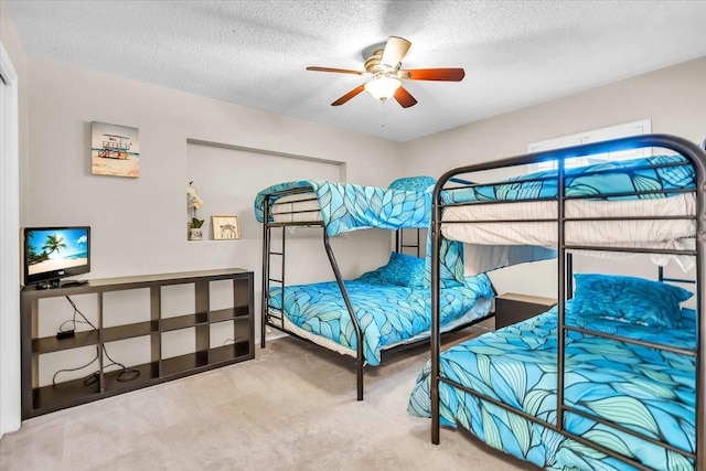 6731 Washington Pl, Bradenton, FL 34207 - carpeted bedroom with a textured ceiling and a ceiling fan