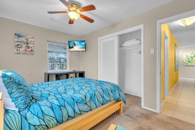 6731 Washington Pl, Bradenton, FL 34207 - bedroom featuring a closet, carpet flooring, baseboards, ceiling fan, and a textured ceiling