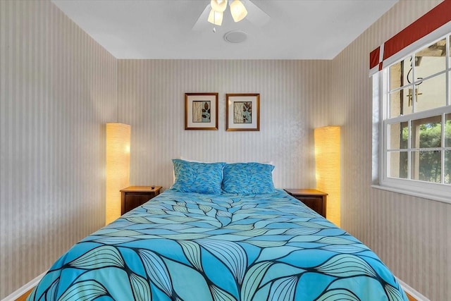 6731 Washington Pl, Bradenton, FL 34207 - bedroom featuring wallpapered walls, baseboards, and ceiling fan