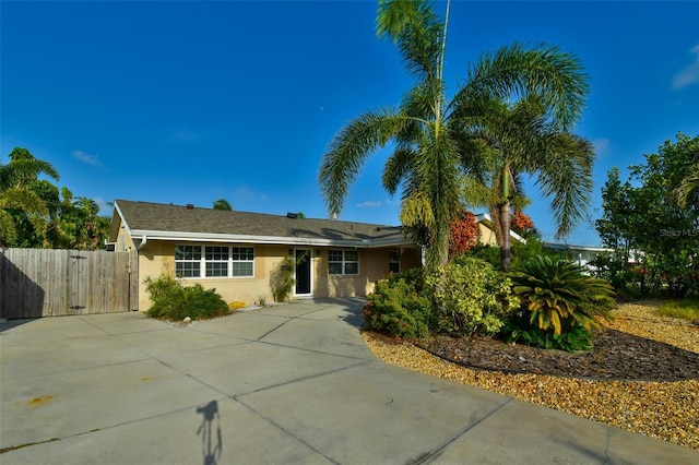 6731 Washington Pl, Bradenton, FL 34207 - single story home with stucco siding, driveway, and a gate
