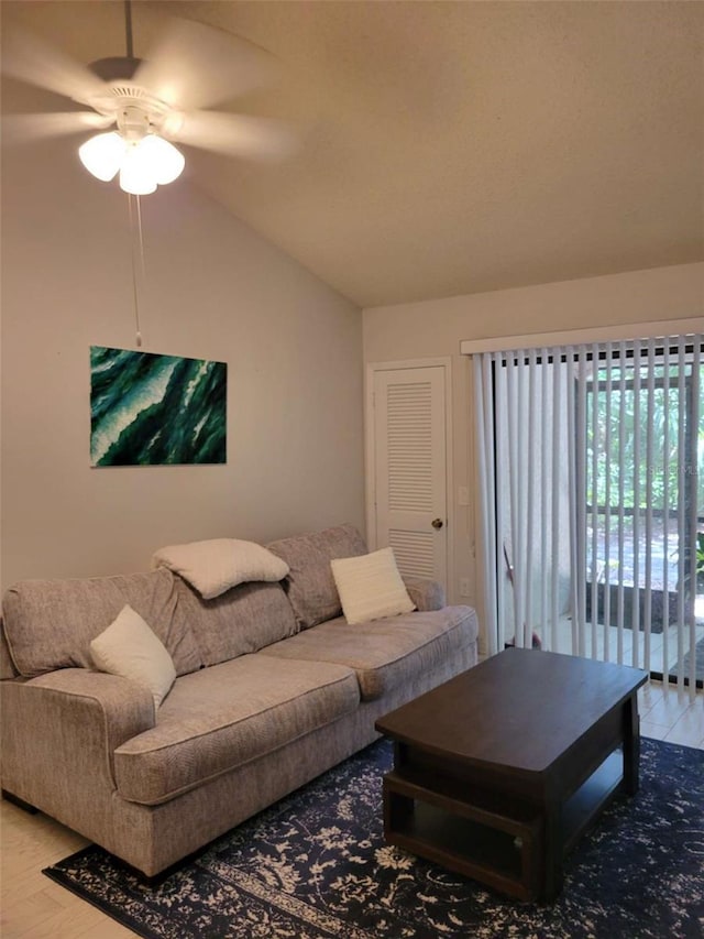 4835 Winslow Beacon Unit 46, Sarasota, FL 34235 - living area with vaulted ceiling, ceiling fan, and light wood-style floors