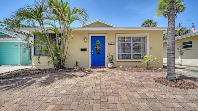 1116 S Moonmist Ct Unit M12, Sarasota, FL 34242 - view of front facade featuring stucco siding