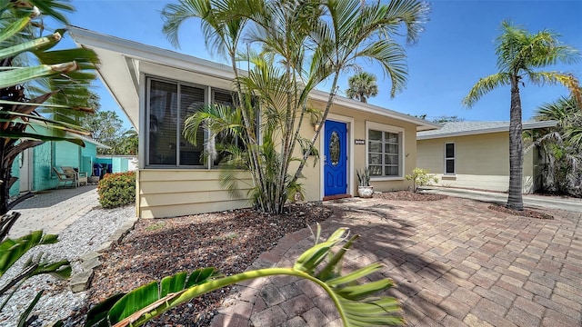 1116 S Moonmist Ct Unit M12, Sarasota, FL 34242 - property entrance featuring stucco siding and a patio
