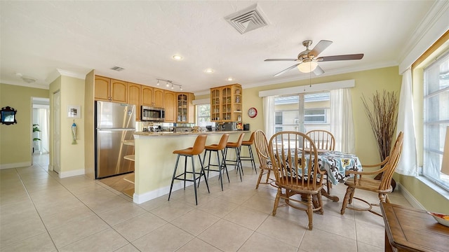 1116 S Moonmist Ct Unit M12, Sarasota, FL 34242 - dining area with crown molding, light tile patterned floors, ceiling fan, and recessed lighting