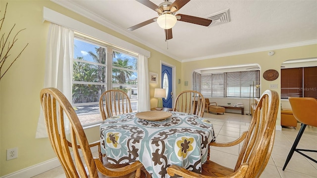 1116 S Moonmist Ct Unit M12, Sarasota, FL 34242 - dining room featuring light tile patterned floors, ornamental molding, plenty of natural light, and ceiling fan