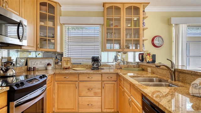 1116 S Moonmist Ct Unit M12, Sarasota, FL 34242 - kitchen featuring appliances with stainless steel finishes, crown molding, light stone countertops, glass insert cabinets, and light brown cabinetry