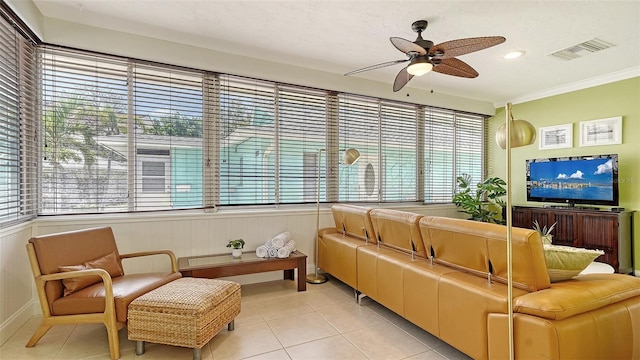 1116 S Moonmist Ct Unit M12, Sarasota, FL 34242 - living room featuring light tile patterned floors, ceiling fan, and ornamental molding