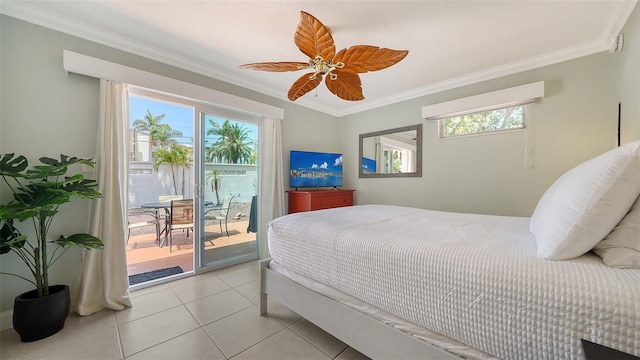 1116 S Moonmist Ct Unit M12, Sarasota, FL 34242 - bedroom with access to exterior, crown molding, light tile patterned flooring, and a ceiling fan