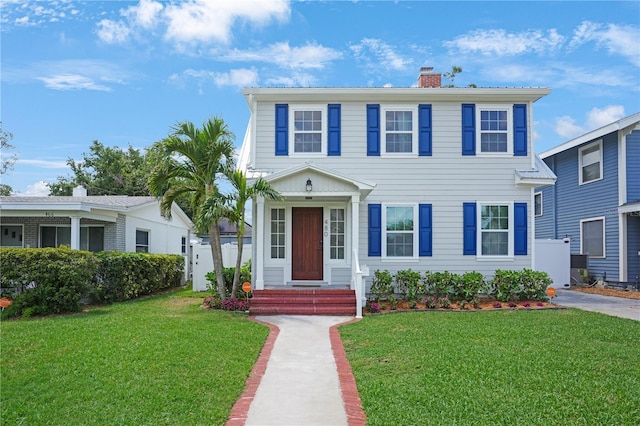 480 28th Ave N, Saint Petersburg, FL 33704 - view of front facade with a chimney and entry steps