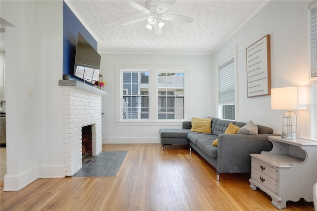 480 28th Ave N, Saint Petersburg, FL 33704 - living area featuring light wood-type flooring, ceiling fan, plenty of natural light, a textured ceiling, and baseboards