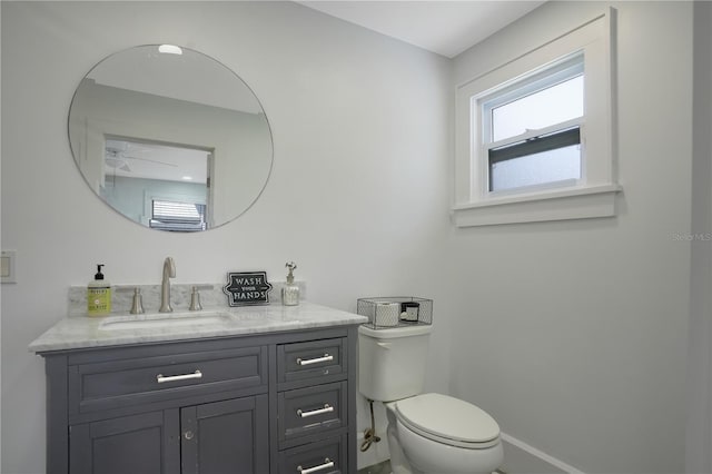 480 28th Ave N, Saint Petersburg, FL 33704 - bathroom with vanity, toilet, and baseboards