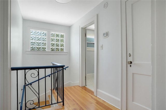 480 28th Ave N, Saint Petersburg, FL 33704 - corridor with an upstairs landing, wood finished floors, and baseboards