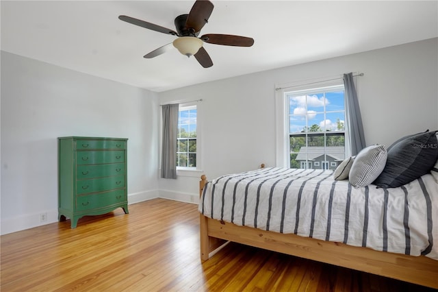 480 28th Ave N, Saint Petersburg, FL 33704 - bedroom featuring light wood finished floors, baseboards, and a ceiling fan
