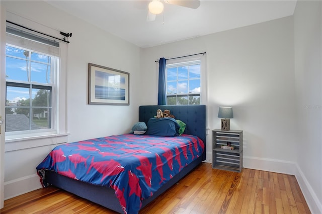 480 28th Ave N, Saint Petersburg, FL 33704 - bedroom featuring hardwood / wood-style floors, multiple windows, and baseboards