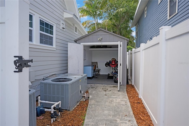 480 28th Ave N, Saint Petersburg, FL 33704 - view of patio with central air condition unit and a detached garage