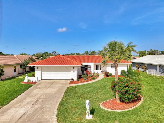 74 Windsor Dr, Englewood, FL 34223 - view of front facade with stucco siding, an attached garage, driveway, and a front yard