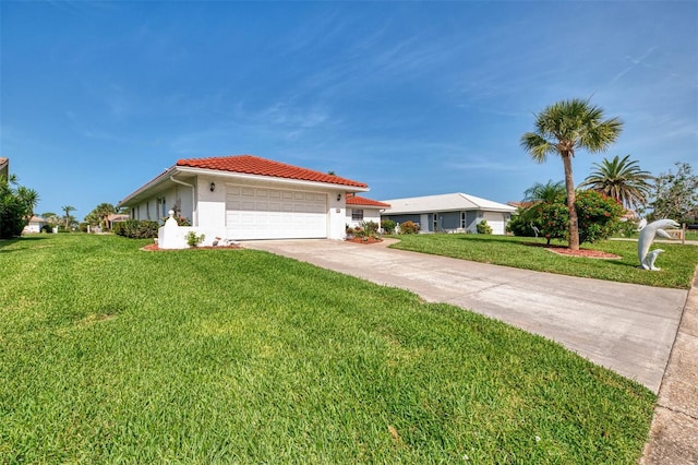 74 Windsor Dr, Englewood, FL 34223 - mediterranean / spanish-style home with a tile roof, an attached garage, a front yard, and stucco siding