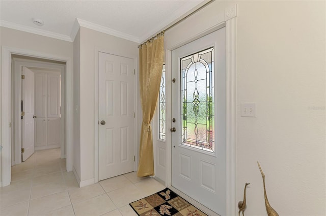 74 Windsor Dr, Englewood, FL 34223 - entryway with light tile patterned floors and crown molding