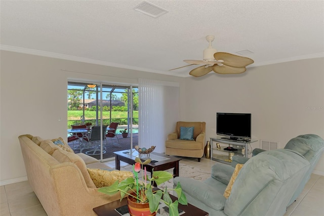 74 Windsor Dr, Englewood, FL 34223 - living room with a ceiling fan, ornamental molding, light tile patterned floors, and a textured ceiling