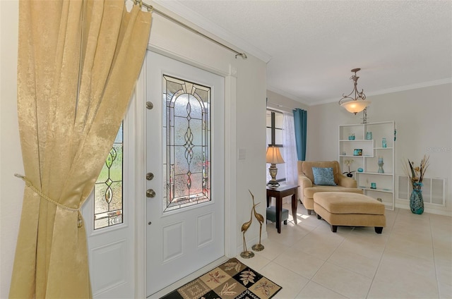 74 Windsor Dr, Englewood, FL 34223 - foyer entrance with crown molding, light tile patterned flooring, and a textured ceiling
