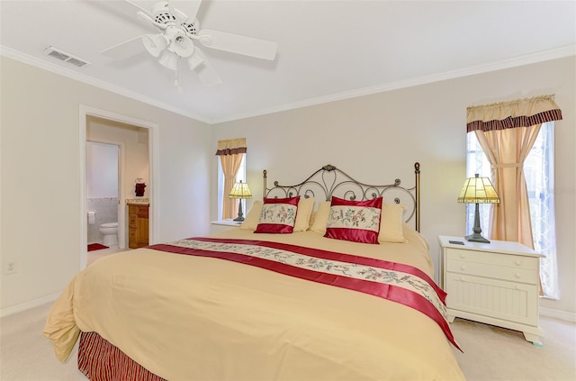 74 Windsor Dr, Englewood, FL 34223 - carpeted bedroom with ornamental molding, ensuite bath, and a ceiling fan