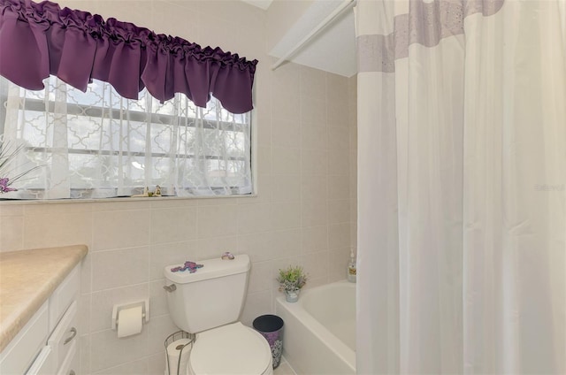 74 Windsor Dr, Englewood, FL 34223 - full bath featuring vanity, tile walls, and shower / tub combo with curtain