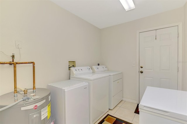 74 Windsor Dr, Englewood, FL 34223 - laundry room with water heater, washer and clothes dryer, and light tile patterned floors