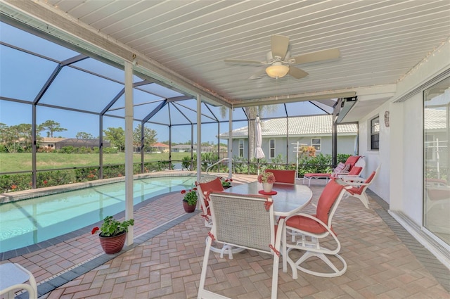 74 Windsor Dr, Englewood, FL 34223 - sunroom / solarium featuring a ceiling fan and a pool