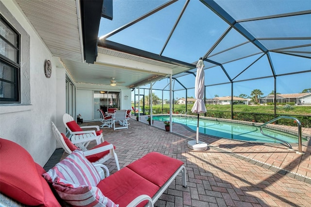 74 Windsor Dr, Englewood, FL 34223 - swimming pool with a patio, a ceiling fan, outdoor dining space, and a lanai