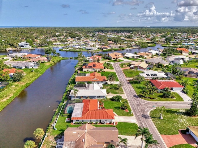 74 Windsor Dr, Englewood, FL 34223 - aerial perspective of suburban area featuring a large body of water