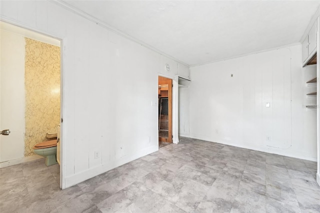 9300 Gulf Blvd, St Pete Beach, FL 33706 - unfurnished bedroom featuring ornamental molding, a closet, and ensuite bath