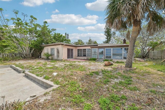 9300 Gulf Blvd, St Pete Beach, FL 33706 - back of house with a patio area, a fenced backyard, and stucco siding