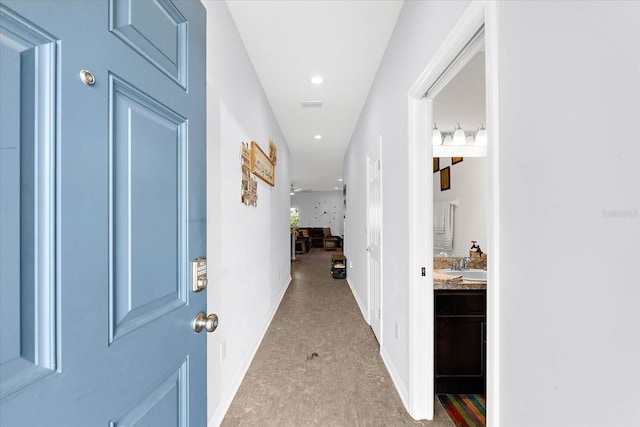 4644 Vignette Way, Sarasota, FL 34240 - hallway featuring a sink and recessed lighting