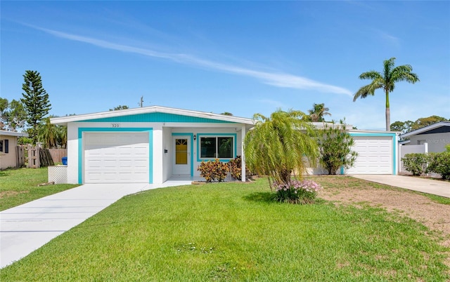320 59th St W, Bradenton, FL 34209 - ranch-style house featuring concrete driveway, a garage, and a front yard