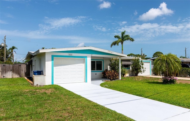 320 59th St W, Bradenton, FL 34209 - ranch-style house with a garage, driveway, and stucco siding