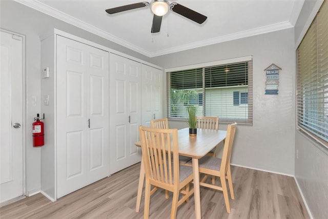 320 59th St W, Bradenton, FL 34209 - dining room featuring ceiling fan, light wood-style floors, ornamental molding, and baseboards