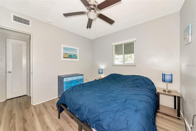 320 59th St W, Bradenton, FL 34209 - bedroom featuring light wood-style floors, a ceiling fan, and baseboards
