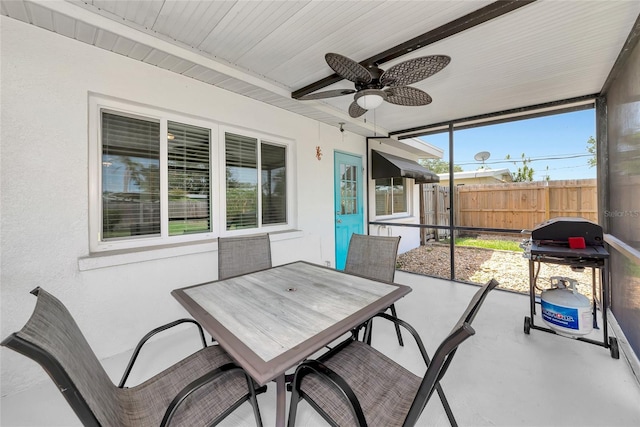 320 59th St W, Bradenton, FL 34209 - sunroom with a ceiling fan, beam ceiling, and outdoor dining space