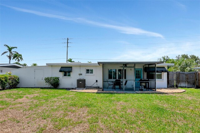320 59th St W, Bradenton, FL 34209 - rear view of property featuring cooling unit, ceiling fan, a patio area, and stucco siding