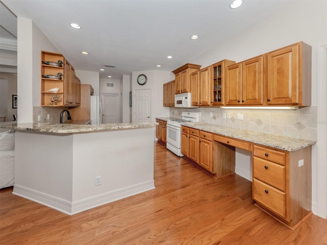 673 Crane Prairie Way, Osprey, FL 34229 - kitchen featuring white appliances, open shelves, decorative backsplash, a peninsula, and light stone countertops