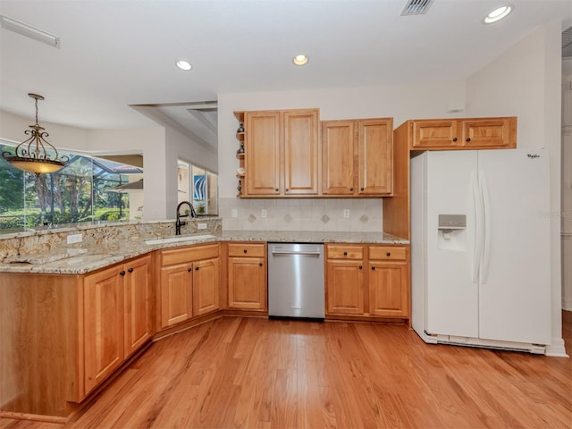 673 Crane Prairie Way, Osprey, FL 34229 - kitchen featuring stainless steel dishwasher, white refrigerator with ice dispenser, light wood finished floors, light stone counters, and decorative light fixtures