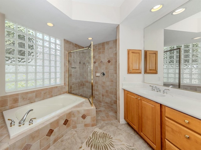 673 Crane Prairie Way, Osprey, FL 34229 - full bath featuring a garden tub, vanity, tiled shower, recessed lighting, and tile patterned flooring