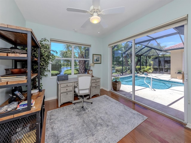 673 Crane Prairie Way, Osprey, FL 34229 - office with a sunroom, ceiling fan, wood finished floors, and healthy amount of natural light